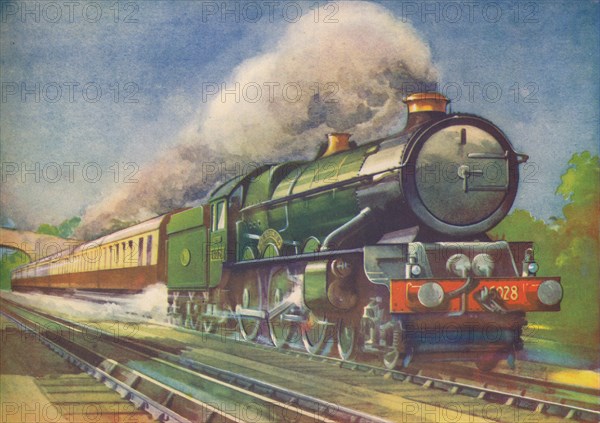 Cheltenham Flyer, G.W.R., picking up water at Goring', 1940. Artist: Unknown.