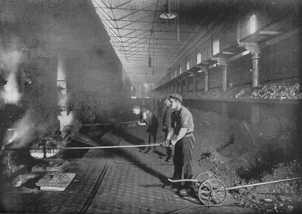 Drawing retorts by hand, South Metropolitan Gasworks, Peckham, London, 1903 (1903). Artist: Unknown.