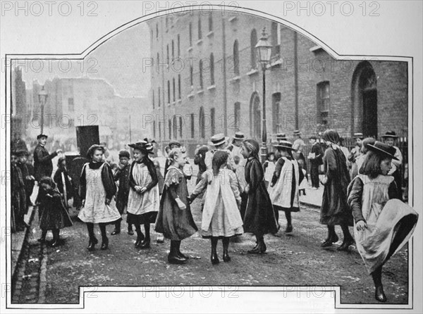 Dancing to a street organ, London, c1901 (1901). Artist: Unknown.
