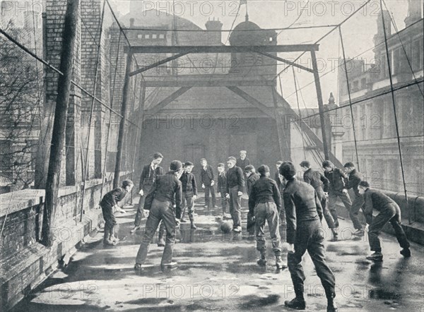 Boys playing football on the roof of St Paul's Cathedral Choir School, London, c1901 (1901). Artist: Unknown.