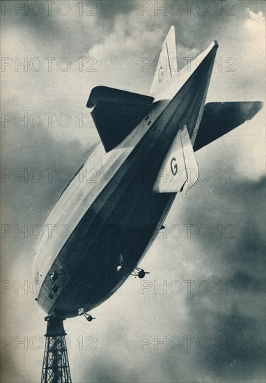 British rigid airship R101 riding at her mooring mast at Cardington, Bedfordshire, c1929 (c1937). Artist: Unknown.