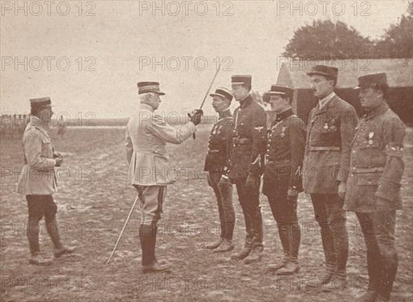 A French General conferring decorations on aviators, c1918 (1919). Artist: Unknown.