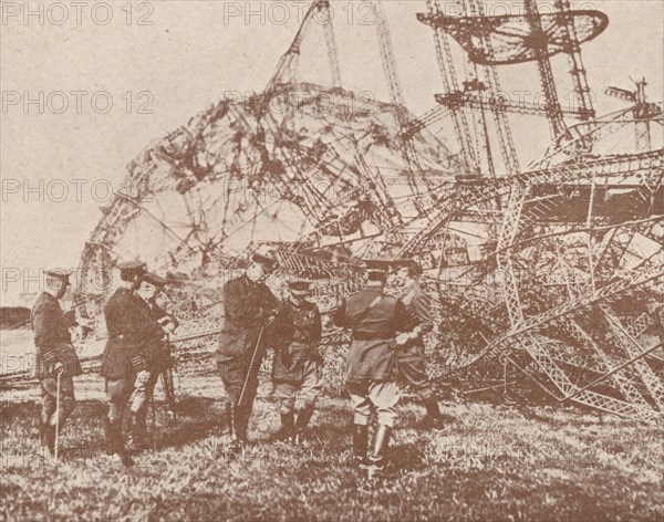 British staff officers examining the wreckage of a Zeppelin brought down in England, c1917 (1919). Artist: Unknown.