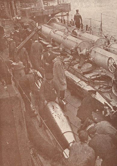 Cleaning and adjusting torpedoes, c1917 (1919). Artist: Unknown.