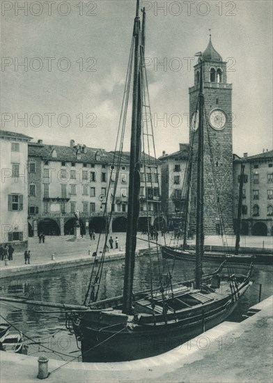 Harbour and Torre Apponale, Riva del Garda, Italy, 1927. Artist: Eugen Poppel.