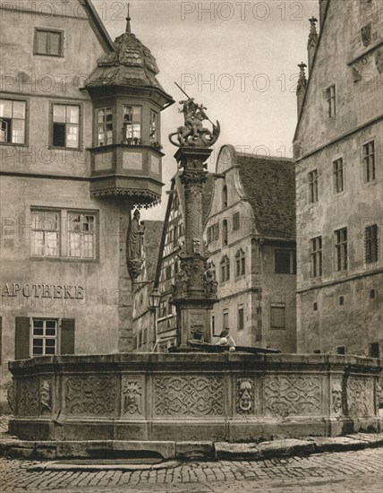 'Rothenburg o. d. T. - St. George's Fountain - Marien-Apotheke', 1931. Artist: Kurt Hielscher.