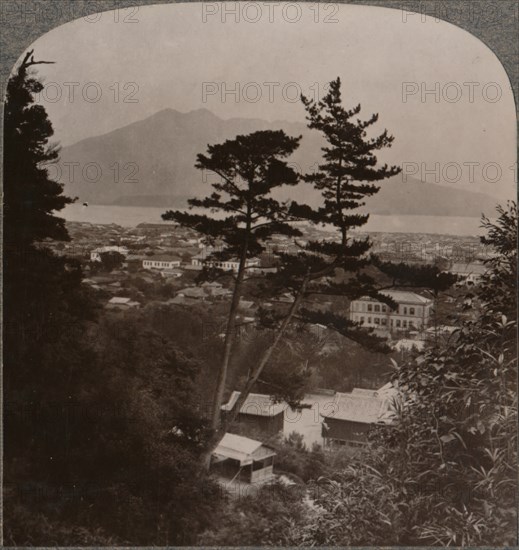 'Vista from hills above Kagoshima over Lake to distant Sakurajima volcano, Japan', 1904. Artist: Unknown.