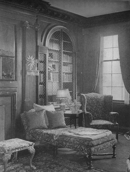 Comfortable corner in the library showing bookcase, house of Miss Anne Morgan, New York City, 1924. Artist: Unknown.