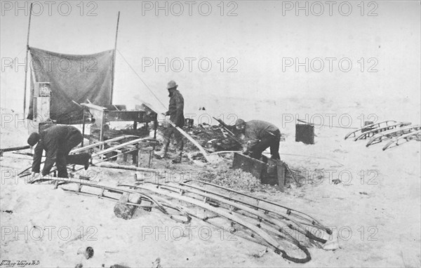 'Fitting the Hand-Sledges with Runners. July, 1895', (1897). Artist: Unknown.