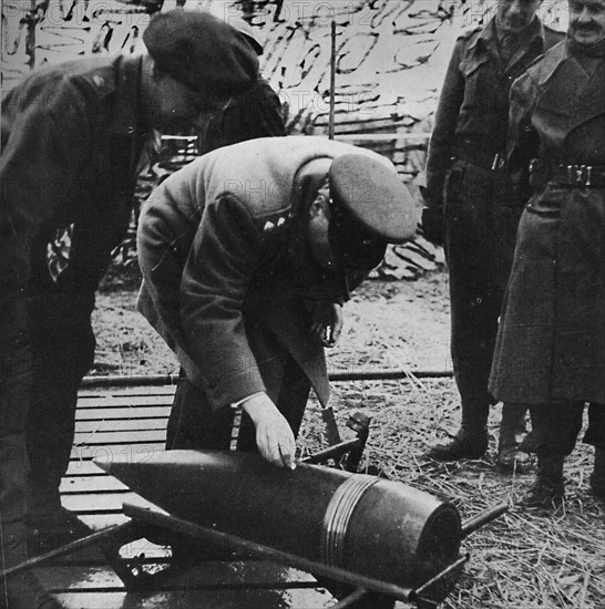 'Mr. Churchill autographing a present for Hitler', c1940s, (1945). Artist: Unknown.