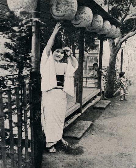 'Sweet natured smile of tea-house maid, called nesan - elder sister', c1900, (1921).  Artist: Julian Leonard Street.