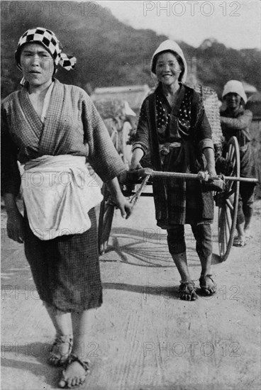 ''Three generations of women moving a cart with grandmother at the rear, pushing', c1900, (1921).  Artist: Julian Leonard Street.