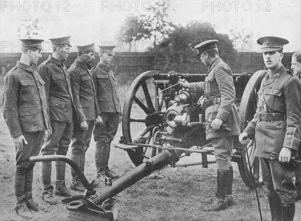 'Artillery recruits having the mechanism of an 18-pounder explained to them', 1915. Artist: Unknown.
