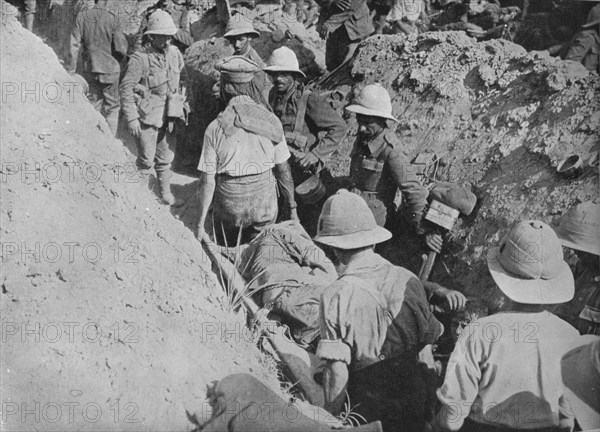 'Carrying wounded through the trenches', 1915. Artist: Unknown.