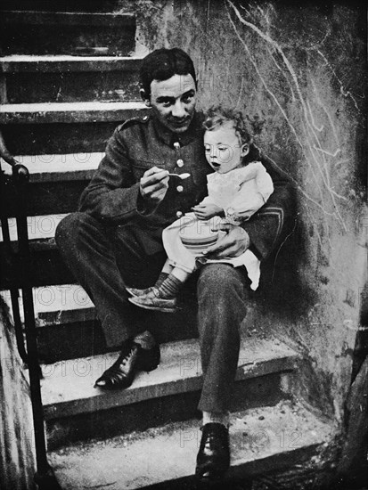 'One of the New Army making himself useful in his billet', 1915. Artist: Unknown.