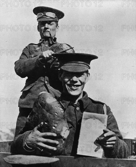 'The Soldier and his Rations: A photograph taken at one of the British camps in France', 1914. Artist: Unknown.