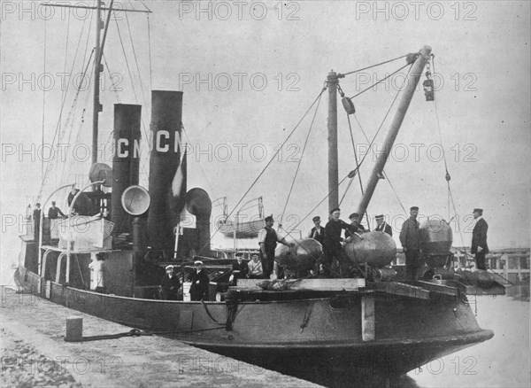 'A German mine layer leaving port with her mines ready on deck', 1914. Artist: Unknown.