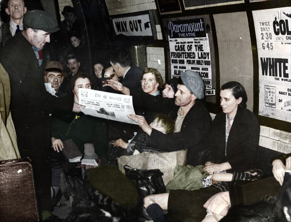 Paper seller down in the underground, London, c.1940. Artist: Unknown.