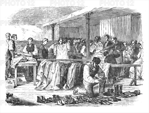 'The Cotton Famine: Distribution of Clothes to Operatives, Manchester', 1904. Artist: Unknown.