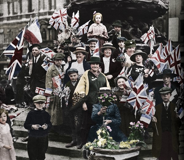 Victory celebrations underneath Eros, Piccadilly, London, 1918, (1938). Artist: Unknown.