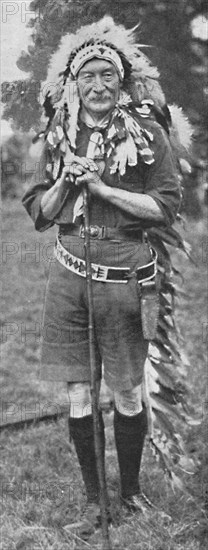 Sir Robert Baden-Powell, arrayed in the dress of a Red Indian tribe', c1925