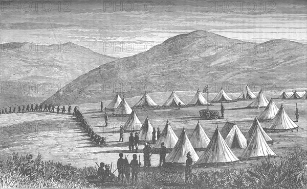 'Sir Garnet Wolseley's Camp at Ulundi: Zulus Coming In To Give Up Their Arms', c1880. Artist: Unknown.