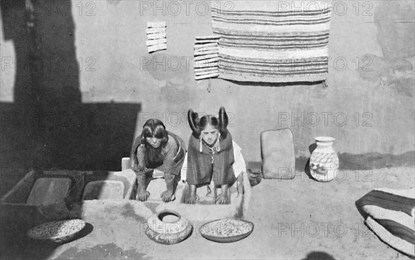 Hopi Indian women grinding corn meal, Walpi, Arizona, 1912. Artist: Robert Wilson Shufeldt.