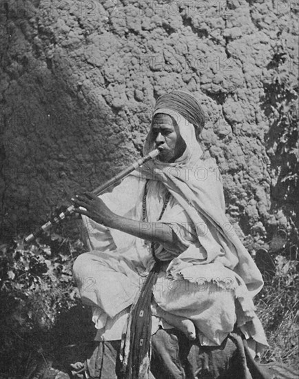 Algerian native flute player, 1912. Artist: Unknown.