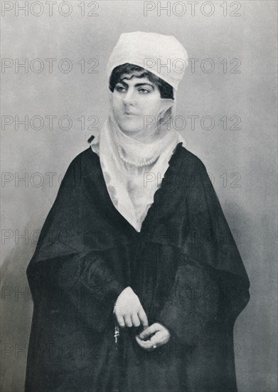 A Turkish lady in outdoor costume, 1912. Artist: Unknown.