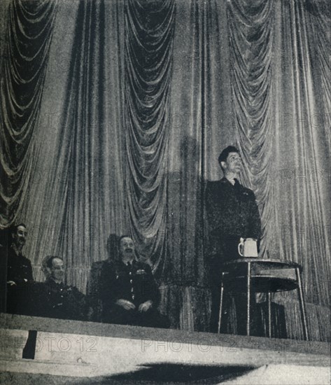 'Flight Lt. J. Nicholson, V.C., stresses the importance of discipline to Cadets', 1941. Artist: Cecil Beaton.