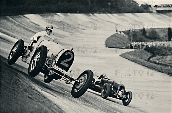 'Earl Howe and Sir Henry Birkin racing at Brooklands', 1937. Artist: Unknown.