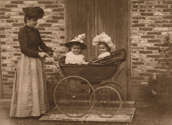 'Woman and children in a pushchair', 1937. Artist: Unknown.