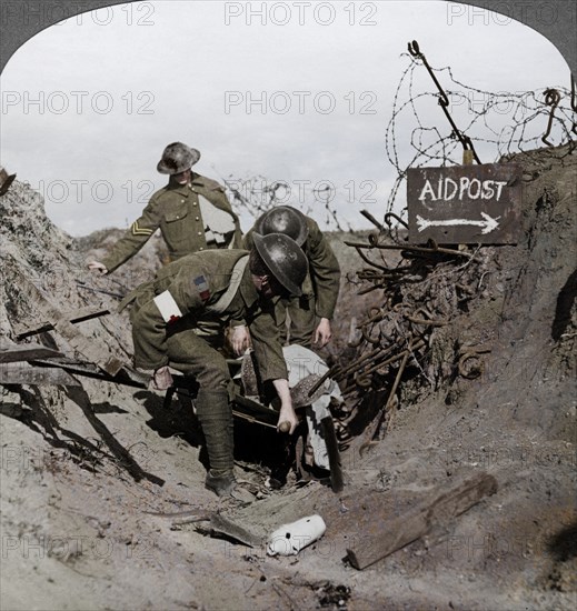 Carrying a wounded soldier to a first aid post, Passchendaele, Belgium, World War I, 1914-1918. Artist: Realistic Travels Publishers.