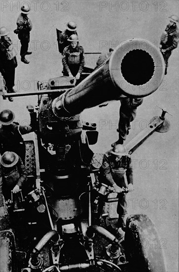 On target! - A 3.7 inch gun detachment at battle practice, 1943. Artist: Unknown.