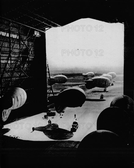 Putting barrage ballons into a hangar, 1943. Artist: Unknown.