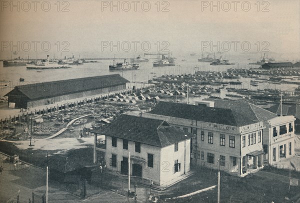 'Singapore Harbour is always crowded with shipping of many type and nationalities', 1937. Artist: Unknown.