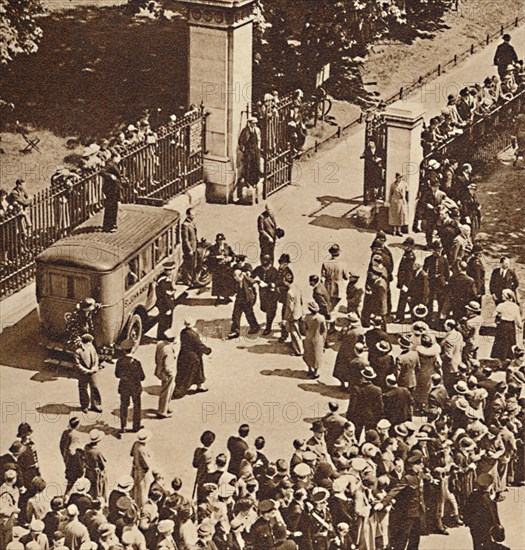 'Crowd watches the arrested man taken to police van', 1937. Artist: Unknown.