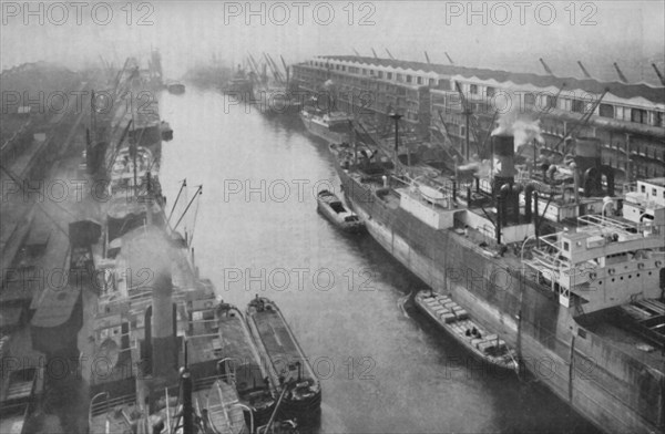 'A Great Dockland of the North, Thirty-Four Miles from Sea and Yet a Port', c1935. Artist: Manchester Ship Canal Company.