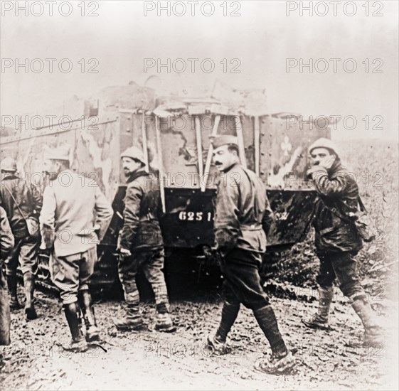 Soldiers walking behind tank, c1914-c1918. Artist: Unknown.