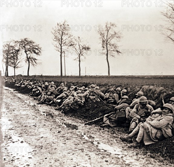 Troops resting by the side of a road, northern France, c1914-c1918. Artist: Unknown.