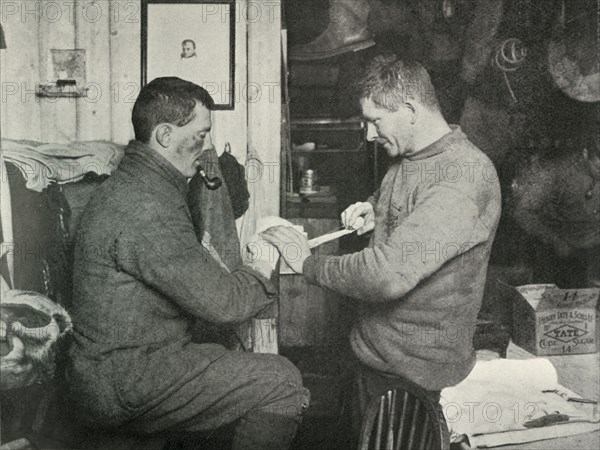 'Petty Officer Evans Binding Up Dr. Atkinson's Hand', 5 July 1911, (1913). Artist: Herbert Ponting.