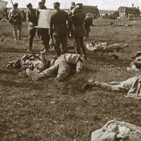 Burying bodies, Sainte-Marie-à-Py, northern France, c1914-c1918. Artist: Unknown.