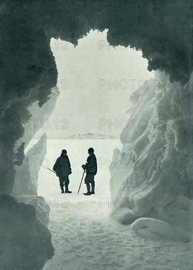 'An Ice Grotto - Tent Island in Distance (Captain Scott and Wright)', c1911, (1913). Artist: Herbert Ponting.