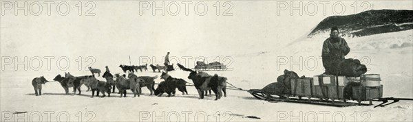 'Meares and Demetri with Their Dog Teams Leaving Hut Point', c1911, (1913). Artist: Herbert Ponting.