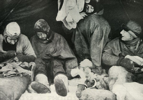 'Members of the Polar Party Getting Into Their Sleeping-Bags', c1911, (1913).  Artist: Herbert Ponting.