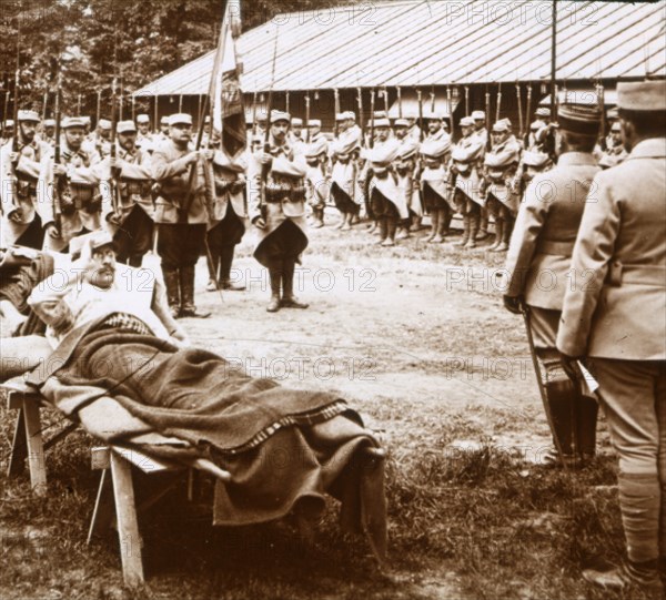 Wounded officer salutes the flag, c1914-c1918. Artist: Unknown.