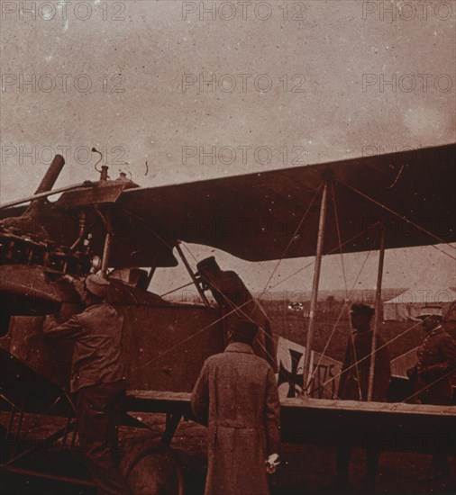 Checking aircraft with the pilot, 1916. Artist: Unknown.