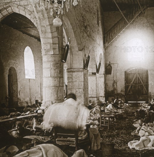 Makeshift hospital in a church, Marne, northern France, 1914. Artist: Unknown.