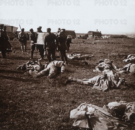 Burying bodies, Sainte-Marie-à-Py, northern France, c1914-c1918. Artist: Unknown.