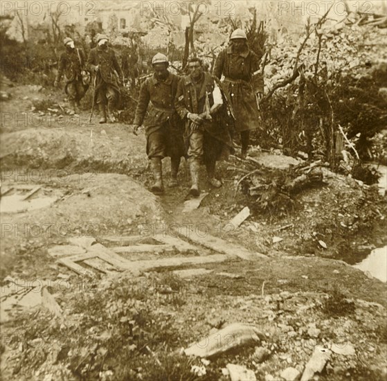 Wounded French infantrymen arriving at Chateau d'Esnes, Verdun, northern France, 1916. Artist: Unknown.